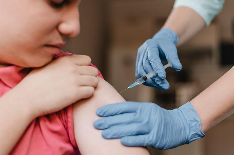 doctor-wearing-gloves-giving-kid-vaccine (1)