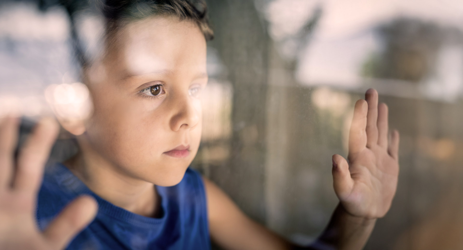 one-sad-little-boy-standing-near-the-window-at-the-2024-09-13-08-59-03-utc